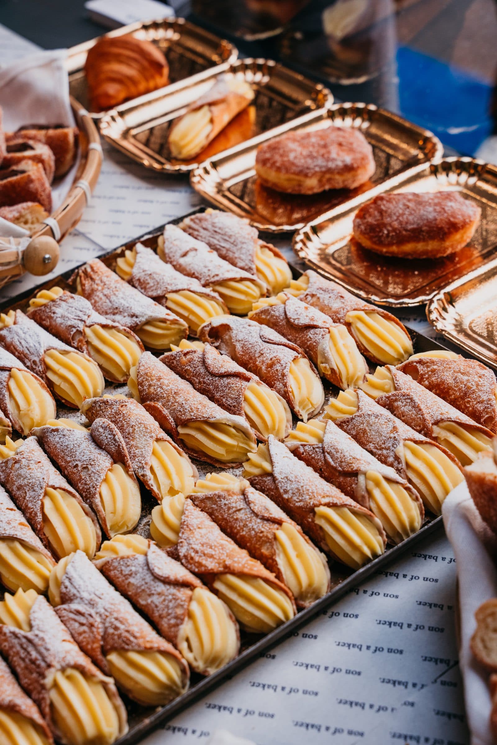 Trays of cannoli and pastries ready to go out