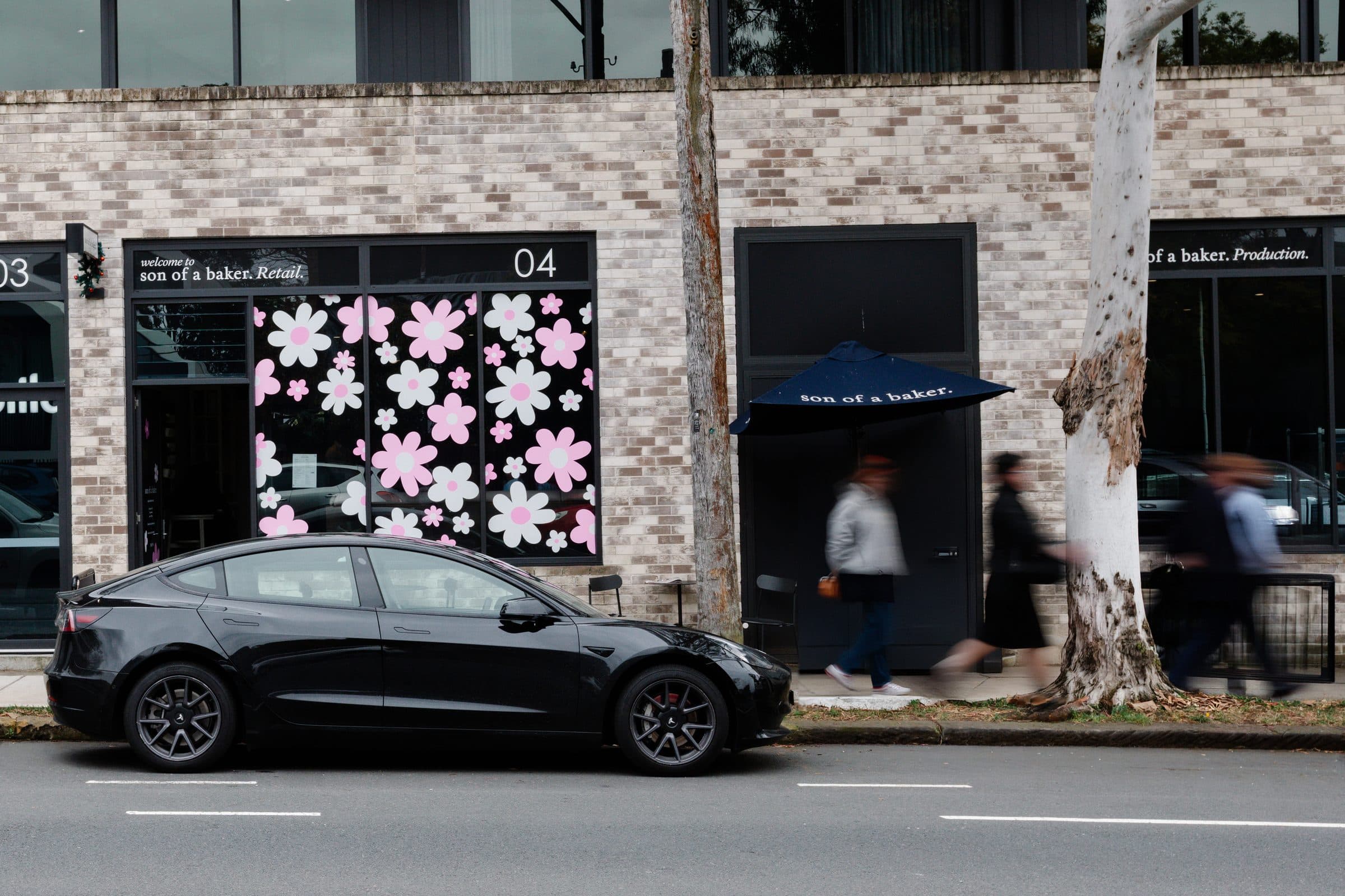 The Son of a Baker shopfront on Moore Street, Leichhardt, with pink flower decals in the windows